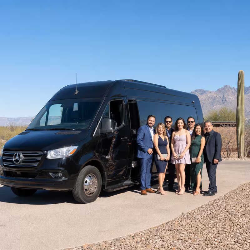 Group beside a Mercedes Sprinter limo from the Tucson fleet