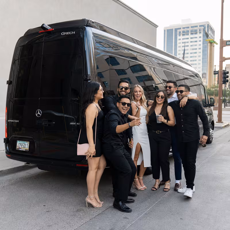 Group boarding a white charter bus for Bachelor & Bachelorette Transportation transportation in Tucson