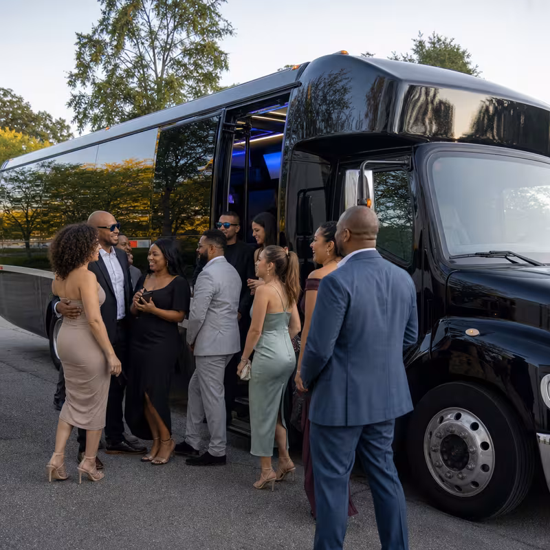Passengers loading luggage while boarding an Tucson group shuttle