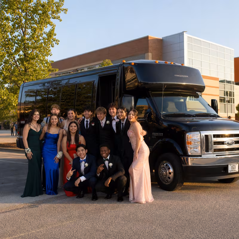 Group boarding a white charter bus for Prom & Homecoming Transportation transportation in Tucson