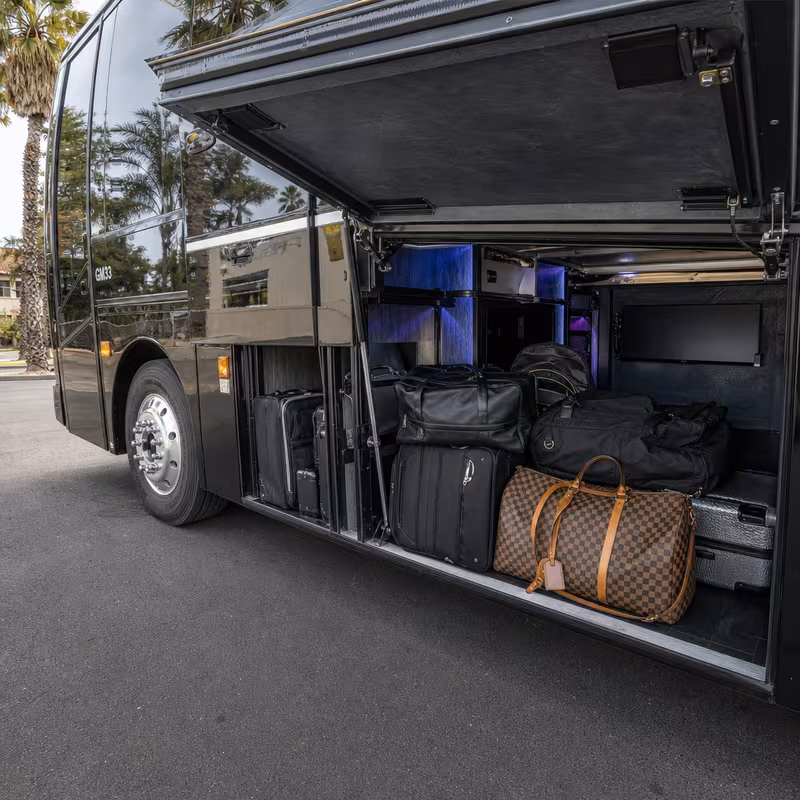 Party bus interior with wraparound leather seating and LED lighting in Tucson