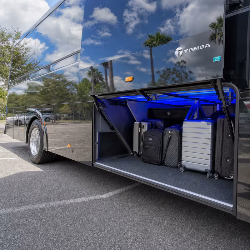 Party bus interior with wraparound leather seating and LED lighting in Tucson